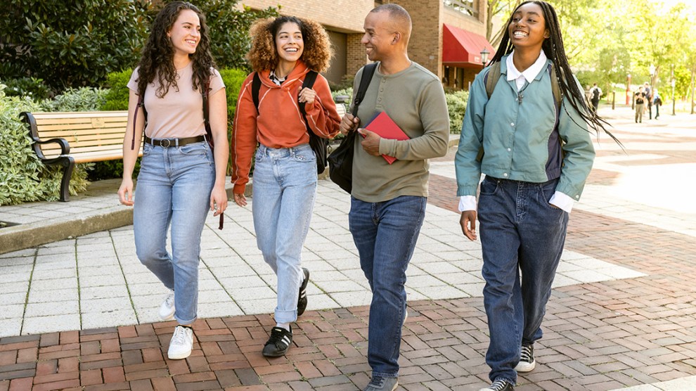 Diverse group of students arrive at University Campus