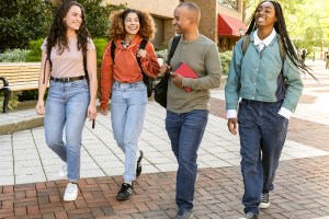 Diverse group of students arrive at University Campus