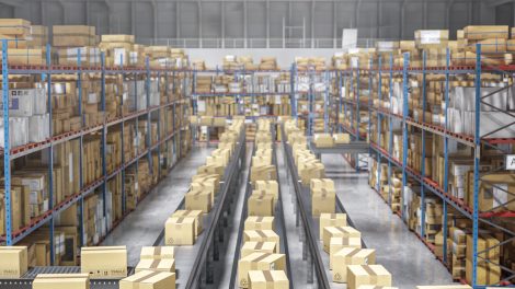 Cardboard boxes moving on conveyor belt in a distribution warehouse